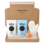 Dárková krabice Kōji: exfoliační ručník na tělo, Kōji Face Towel, přírodní solný deodorant Salt Bar a exfoliační rukavice Kōji Glove.